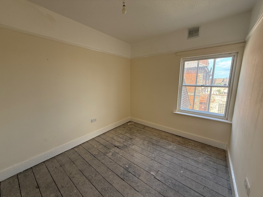 Lot: 127 - THREE-BEDROOM END-TERRACE COTTAGE FOR IMPROVEMENT - Bedroom one with window to front